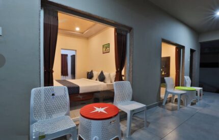 Ground-floor sit-out outside a Deluxe AC Room at Camp Leo Aaranya Gir Resort